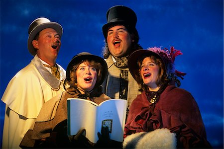 retro christmas images - PORTRAIT OF FOUR CHRISTMAS CAROLERS IN PERIOD COSTUMES Stock Photo - Rights-Managed, Code: 846-02795242