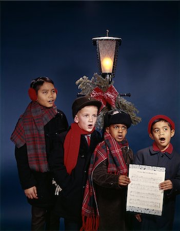 simsearch:846-02795283,k - 1960s GROUP MULTI-ETHNIC BOYS SINGING CHRISTMAS CAROLS UNDER LAMP POST Stock Photo - Rights-Managed, Code: 846-02795283