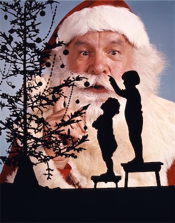 simsearch:846-02797877,k - 1960s SILHOUETTES OF BOY AND GIRL LOOKING UP AT CHRISTMAS TREE SANTA CLAUS IN BACKGROUND Stock Photo - Rights-Managed, Code: 846-02795315