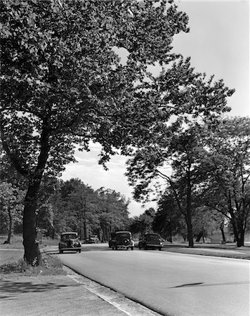 road traffic line of cars - 1930s CARS ON TREE LINED HIGHWAY FAIRMONT PARK PHILADELPHIA PENNSYLVANIA USA Foto de stock - Con derechos protegidos, Código: 846-02795575