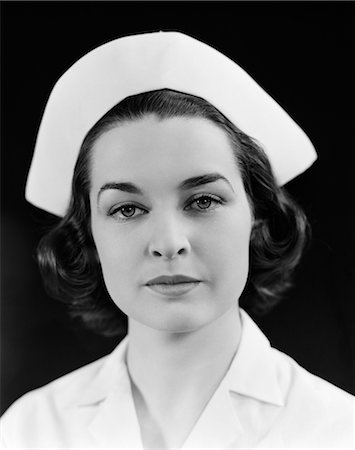 1940s HEAD SHOULDERS PORTRAIT BRUNETTE NURSE SERIOUS EXPRESSION Stock Photo - Rights-Managed, Code: 846-02795668