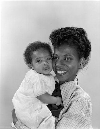 1950s AFRICAN AMERICAN MOTHER HOLDING BABY Stock Photo - Rights-Managed, Code: 846-02795721