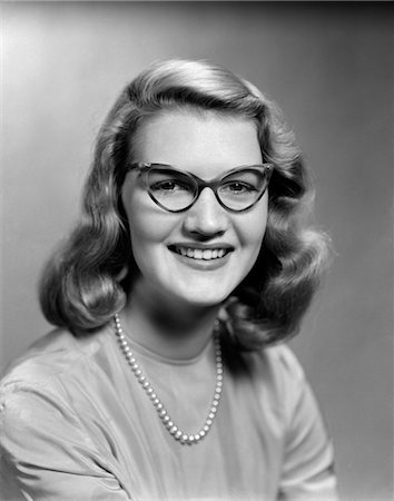 1950s PORTRAIT OF YOUNG WOMAN WEARING POINTED EYE GLASSES Stock Photo - Rights-Managed, Code: 846-02795833
