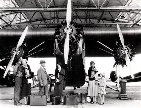 simsearch:846-06112007,k - 1920s 1930s GROUP OF PASSENGERS WAITING IN FRONT OF FORD TRI-MOTOR AIRPLANE Stock Photo - Rights-Managed, Code: 846-02795935