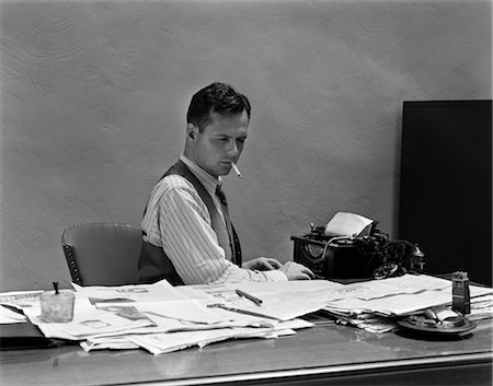 simsearch:846-02793574,k - 1930s 1940s BUSY MAN IN SHIRT SLEEVES BEHIND OFFICE DESK WORKING AT TYPEWRITER SMOKING CIGARETTE Stock Photo - Rights-Managed, Code: 846-02795947