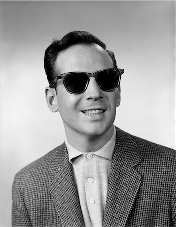 1950s 1960s PORTRAIT OF SMILING BLIND MAN WEARING SPORTS JACKET SHIRT AND VERY DARK PROTECTIVE SUNGLASSES Foto de stock - Con derechos protegidos, Código: 846-02795941