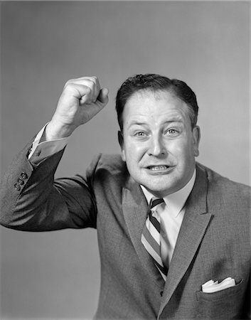 raised - 1950s EXCITED ANGRY BUSINESSMAN RAISING HIS FIST Stock Photo - Rights-Managed, Code: 846-02796159