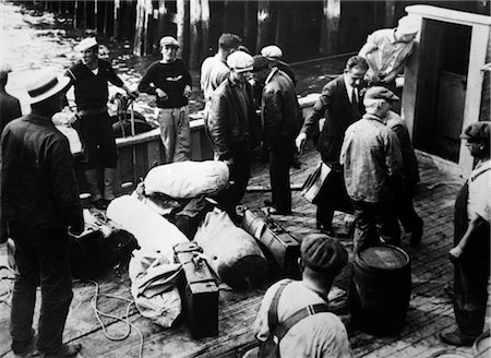 prohibido - 1920s 1930s PROHIBITION CAPTURED RUM RUNNERS ON DECK OF BRITISH SHIP ALCOHOL FORBIDDEN 18TH AMENDMENT Stock Photo - Rights-Managed, Code: 846-02796467