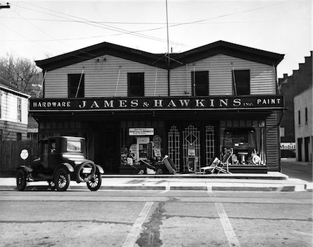 1920s FACADE OF HARDWARE STORE SINGLE CAR PARKED ON STREET IN FRONT Stock Photo - Rights-Managed, Code: 846-02796481