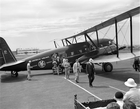 simsearch:846-03163699,k - 1930s NEWARK NJ AIRPORT AMERICAN AIRLINES CONDOR PLANE WITH DISEMBARKING PASSENGERS Stock Photo - Rights-Managed, Code: 846-02796506