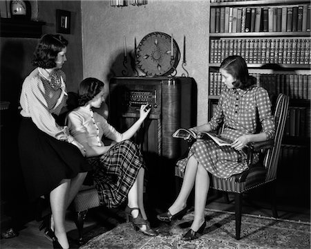 photo of people sit listening to radio - 1940s THREE YOUNG GIRLS SITTING IN LIVING ROOM LISTENING TO RADIO Stock Photo - Rights-Managed, Code: 846-02796561