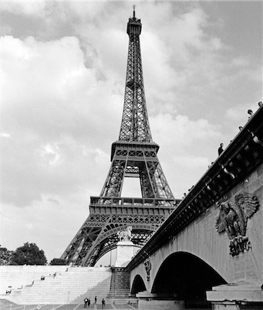 french countryside - 1970s EIFFEL TOWER WITH PEOPLE WALKING UP STAIRS & STANDING ON BRIDGE LEADING TO IT IN FOREGROUND Stock Photo - Rights-Managed, Code: 846-02796644