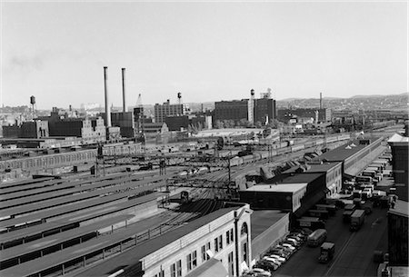 factory in 1950s - 1950s AERIAL OF RAILWAY YARD AT INDUSTRIAL SITE SURROUNDED BY FACTORIES Stock Photo - Rights-Managed, Code: 846-02796703