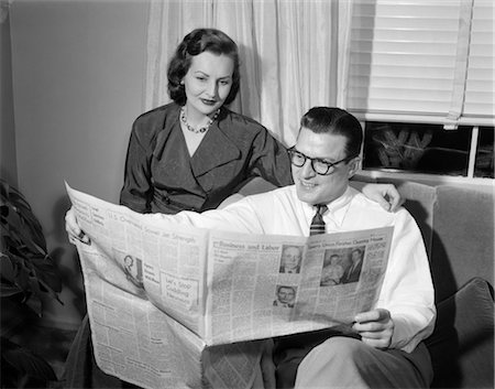 1950s COUPLE MAN WOMAN READING NEWSPAPER Stock Photo - Rights-Managed, Code: 846-02796722