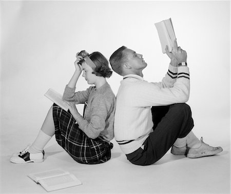 simsearch:846-02797214,k - 1950s COUPLE TEEN BOY GIRL SITTING BACK TO BACK READING BOOKS STUDYING Stock Photo - Rights-Managed, Code: 846-02796790