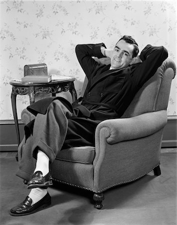 person sitting in lounge chair - 1940s MAN IN ROBE SITTING IN LOUNGE CHAIR Stock Photo - Rights-Managed, Code: 846-02796856