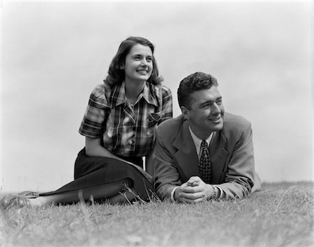 1950s COUPLE LYING ON GRASS Stock Photo - Rights-Managed, Code: 846-02796872