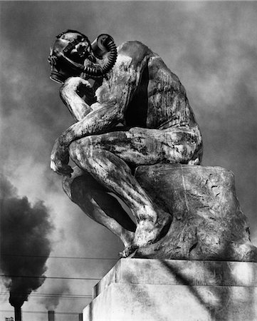 poison - 1970s STATUE OF RODING'S THINKER WEARING GAS MASK WITH SMOKE STACKS BILLOWING IN BACKGROUND Stock Photo - Rights-Managed, Code: 846-02797081