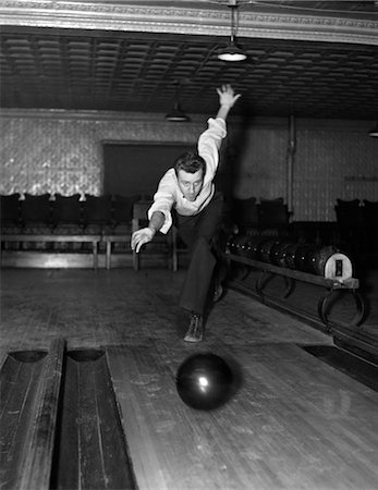 1930s MAN BOWLING JUST RELEASING BALL INTO ALLEY Stock Photo - Rights-Managed, Code: 846-02797140