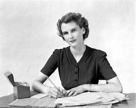 1940s WOMAN AT DESK GOING THROUGH PAPERWORK PAYING BILLS Stock Photo - Rights-Managed, Code: 846-02797244
