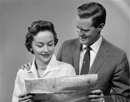 1950s COUPLE LOOKING AT MAP Stock Photo - Rights-Managed, Code: 846-02797370