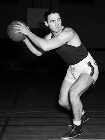 school sport - 1930s BOY PLAYING BASKETBALL INSIDE COURT HOLDING BASKETBALL STANDING IN POSITION Stock Photo - Rights-Managed, Code: 846-02797393