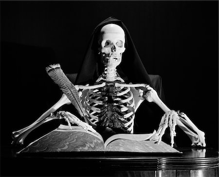 STILL LIFE OF SKELETON WRITING IN LARGE BOOK WITH QUILL PEN Stock Photo - Rights-Managed, Code: 846-02797518