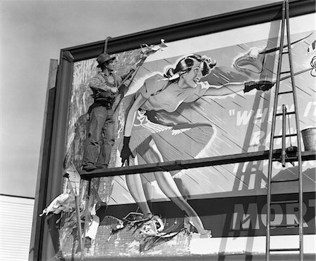 publicity - 1940s MAN ON SCAFFOLD SCRAPING BILLBOARD WITH DRAWING OF WOMAN CAUGHT IN HIGH WIND WITH SKIRT UP Foto de stock - Con derechos protegidos, Código: 846-02797531