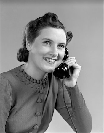 1930s 1940s YOUNG GIRL TALKING ON TELEPHONE Stock Photo - Rights-Managed, Code: 846-02797573