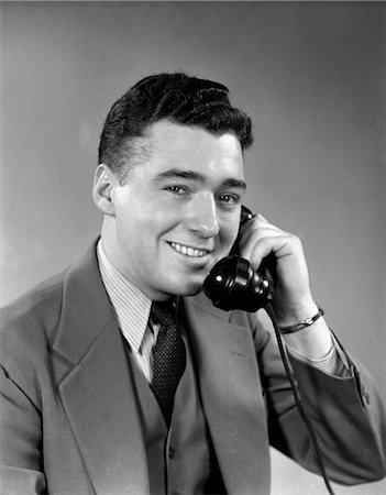 smile electricity - 1950s SMILING MAN SUIT TIE TALKING ON TELEPHONE Stock Photo - Rights-Managed, Code: 846-02797592