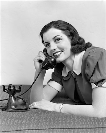 person talking old fashioned phone - 1930s 1940s GIRL TALKING ON TELEPHONE Stock Photo - Rights-Managed, Code: 846-02797625