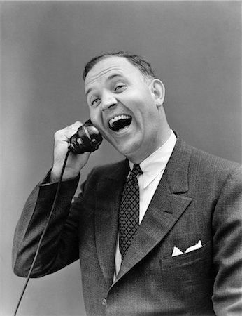 pictures of communication in the 1930s - 1930s MAN IN SUIT LAUGHING TALKING ON TELEPHONE Stock Photo - Rights-Managed, Code: 846-02797623