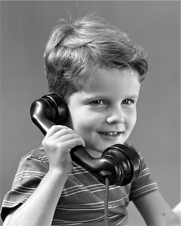 1940s LITTLE BOY TALKING ON TELEPHONE Stock Photo - Rights-Managed, Code: 846-02797702