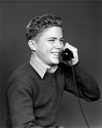 simsearch:846-02793460,k - 1940s YOUNG BOY TALKING ON TELEPHONE SMILING Stock Photo - Rights-Managed, Code: 846-02797712