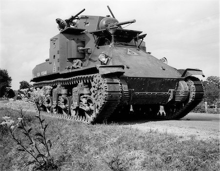 simsearch:846-02791732,k - 1930s 1940s WORLD WAR II ERA US ARMY TANK ONE MAN DRIVING WITH GUNNER Stock Photo - Rights-Managed, Code: 846-02791709