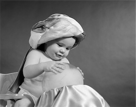 1950s BABY DRESSED AS SWAMI TURBAN HANDS ON CRYSTAL BALL PREDICTING THE FUTURE FORTUNE TELLER MAGIC GYPSY Stock Photo - Rights-Managed, Code: 846-02791975