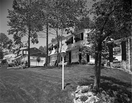 1970s SUBURBAN COMMUNITY WITH TREES MANICURED LAWNS & AWNINGS ON WINDOWS Stock Photo - Rights-Managed, Code: 846-02792020