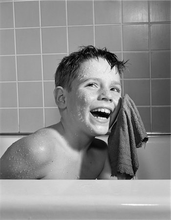 1950s 1960s SMILING BOY WASHING FACE SITTING IN BATHTUB Stock Photo - Rights-Managed, Code: 846-02792061