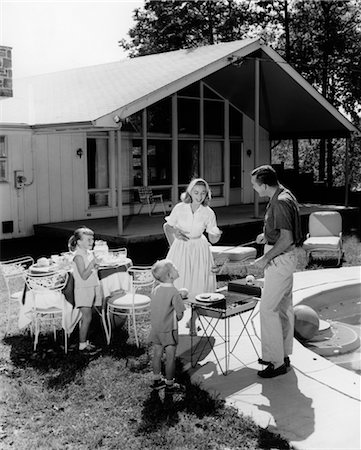 simsearch:846-05646502,k - 1950s FAMILY SERVING HAMBURGERS BESIDE POOL IN BACKYARD COOKOUT Stock Photo - Rights-Managed, Code: 846-02792186