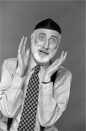 CHARACTER PORTRAIT MAN GRAY BEARD WEAR YARMULKE HEBREW JEWISH SKULLCAP HANDS UP TO FACE GESTURE FUNNY EXPRESSION OY! WORRY COMPLAIN KEVETCH Stock Photo - Rights-Managed, Code: 846-02792216