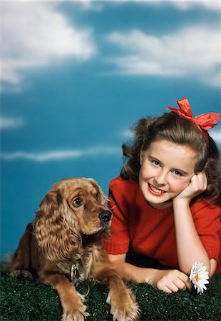 1940s 1950s SMILING TEEN GIRL WITH COCKER SPANIEL DOG Stock Photo - Rights-Managed, Code: 846-02792327