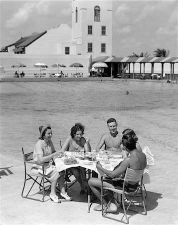 1930s GROUP 5 MEN WOMEN DINING POOL POOLSIDE TABLE VACATION HOTEL TRAVEL FOOD MIAMI FLORIDA Stock Photo - Rights-Managed, Code: 846-02792407