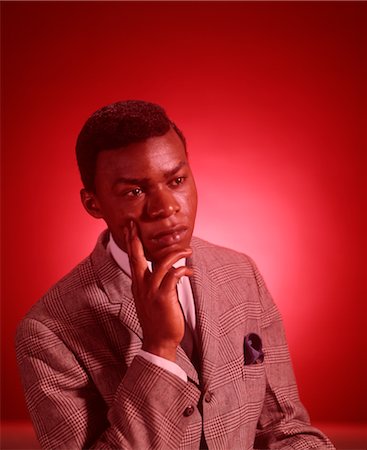 1960s PORTRAIT THOUGHTFUL AFRICAN AMERICAN YOUNG MAN HAND TO CHIN Stock Photo - Rights-Managed, Code: 846-02792576
