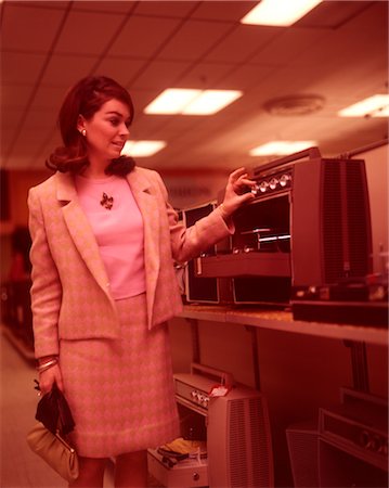 simsearch:846-02792587,k - 1960s WOMAN PINK SUIT SHOPPING FOR STEREO EQUIPMENT Stock Photo - Rights-Managed, Code: 846-02792587
