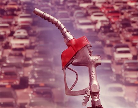 simsearch:846-02794723,k - 1960s NOZZLE OF GASOLINE PUMP WITH TRAFFIC BACKGROUND Stock Photo - Rights-Managed, Code: 846-02792673
