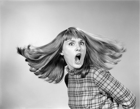 simsearch:846-02793087,k - 1960s PORTRAIT OF WOMAN WITH MOUTH WIDE OPEN AND HAIR FLYING Stock Photo - Rights-Managed, Code: 846-02793098
