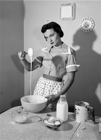 pictures of old fashioned housewife - 1960s HOUSEWIFE MIXING STICKY BATTER IN KITCHEN Stock Photo - Rights-Managed, Code: 846-02793189