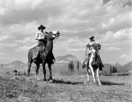 1930s PAIR OF COWBOYS ON HORSEBACK AT GLACIER FIFTY-MILE CAMP Stock Photo - Rights-Managed, Code: 846-02793236