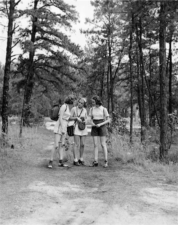 THREE YOUNG LADIES WOMEN WOODS PATH 1940s Stock Photo - Rights-Managed, Code: 846-02793262