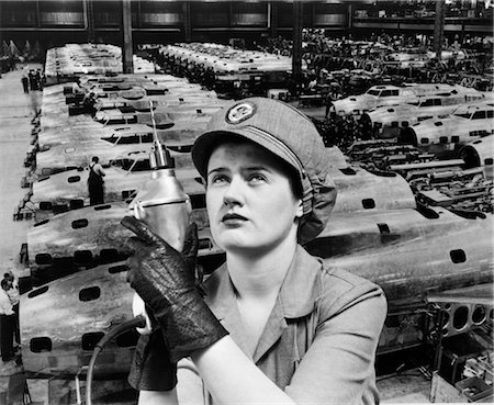 WOMAN ROSIE THE RIVETER SUPERIMPOSED OVER AIRPLANES IN FACTORY 1940s WARTIME WWII WORKER WORK Stock Photo - Rights-Managed, Code: 846-02793381
